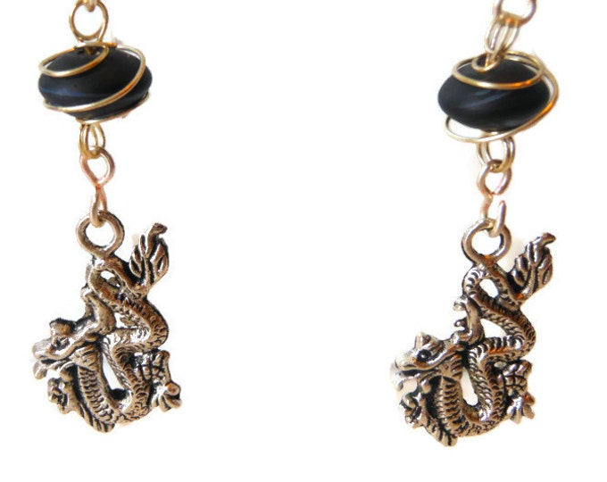 Wire wrapped dragon earrings of Tibetan silver handmade with silver plated wire and caged black frosted glass beads