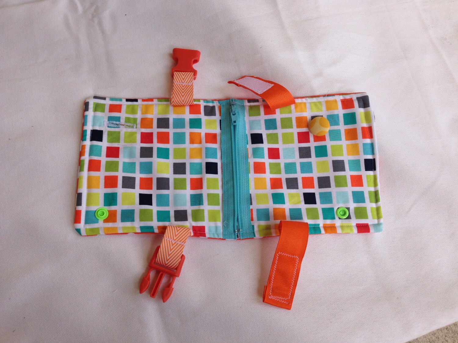 Busy blanket a buckle snap zip Velcro and button toy