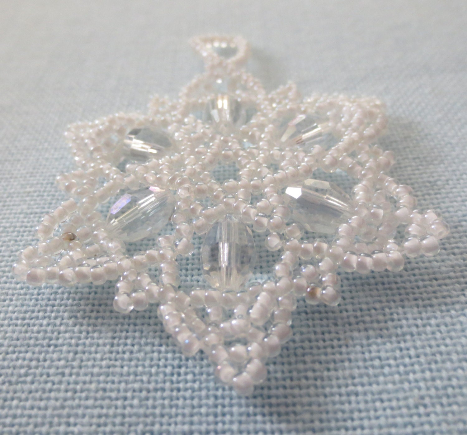 Bead and crystal snowflake / wreath ornament. White and crystal