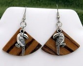 Toucans on African Zebra wood.   Rare African Zebra wood with an overlying toucan charm dangling from surgical steel earwires.  OOAK