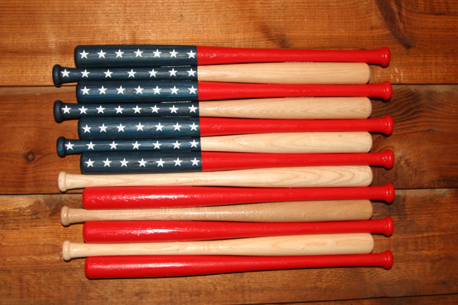 Image of an American flag made from baseball bats. 