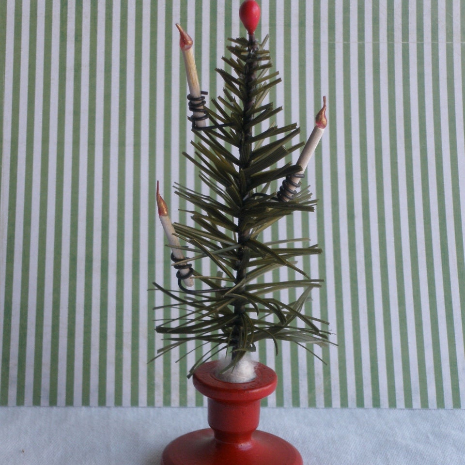 This little bottle brush feather tree is 5.75" inches tall. It comes in white or cedar with wooden, handmade candles in wire holders..