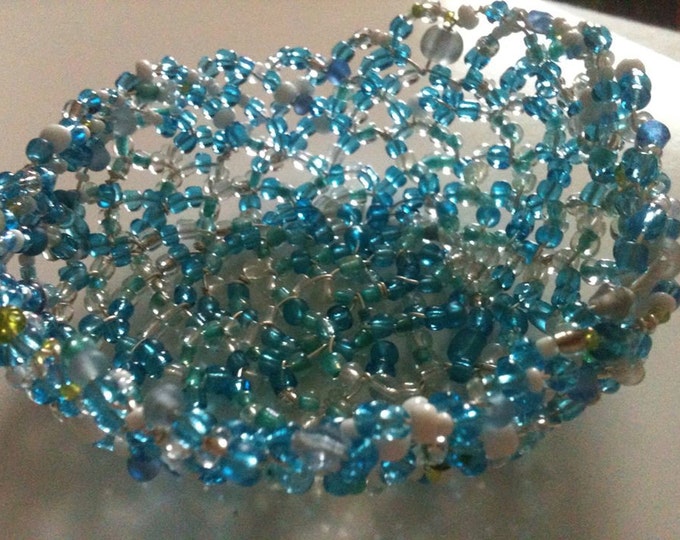beaded mostly blue and white wire basket