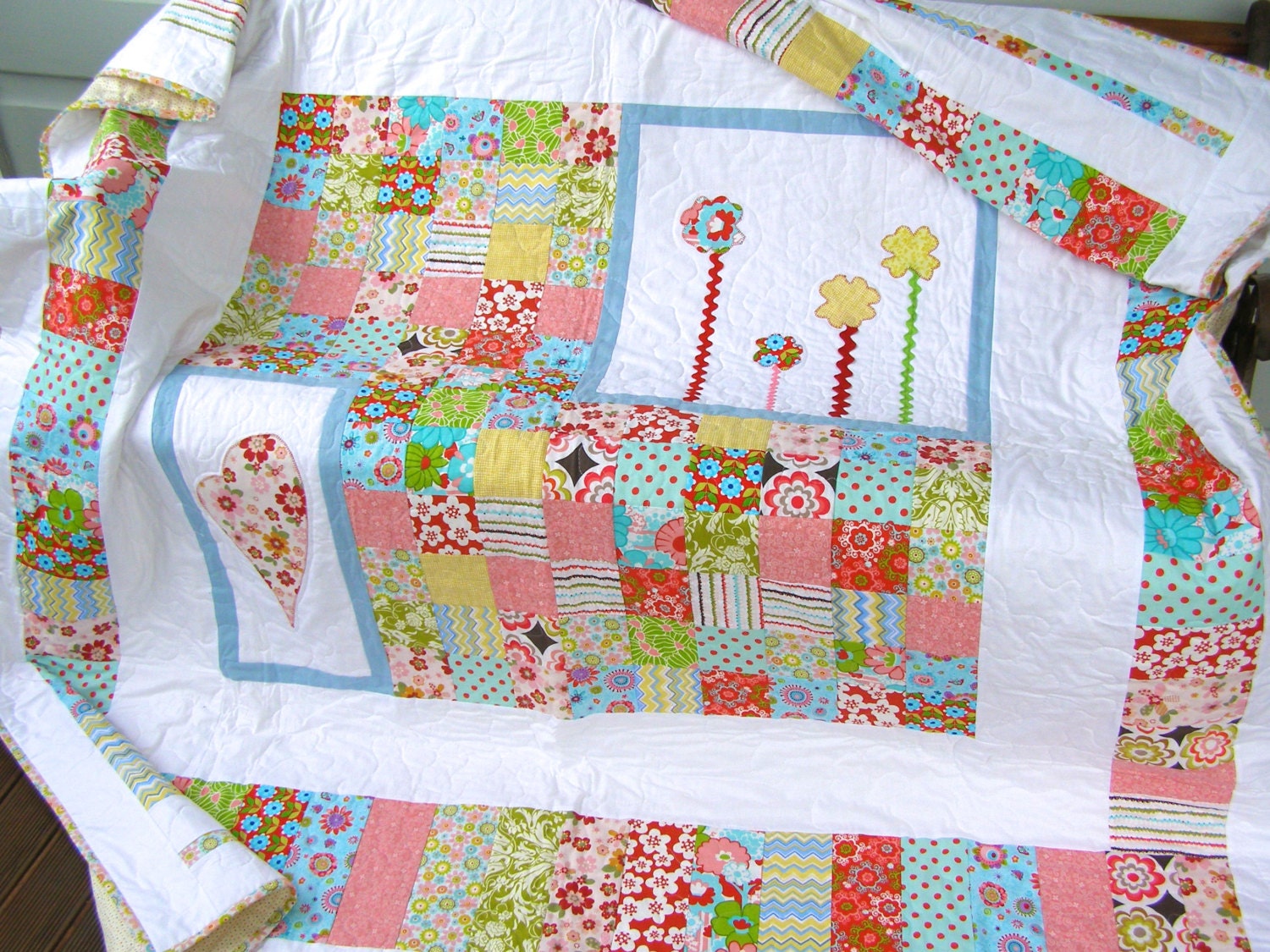 Bright colourful modern patchwork quilt with appliqué