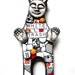 White Trash. (Mixed Media Mosaic Doll Featuring Found Objects and Recycled Elements by Shawn DuBois)