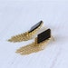 Earrings. Black and gold earrings. Geometric earrings. black, Lozenge-shaped post base, with tiny golden chains.