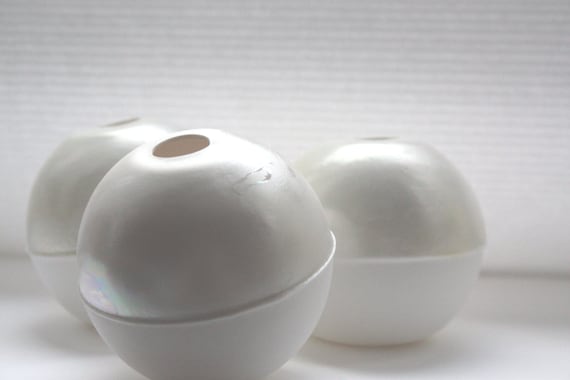 White spheres made from fine bone china with mat by madebymanos