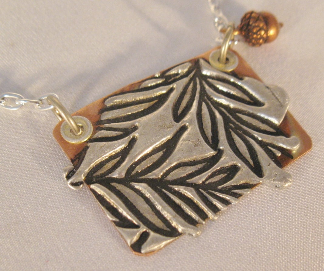 copper and stamped solder necklace with acorn