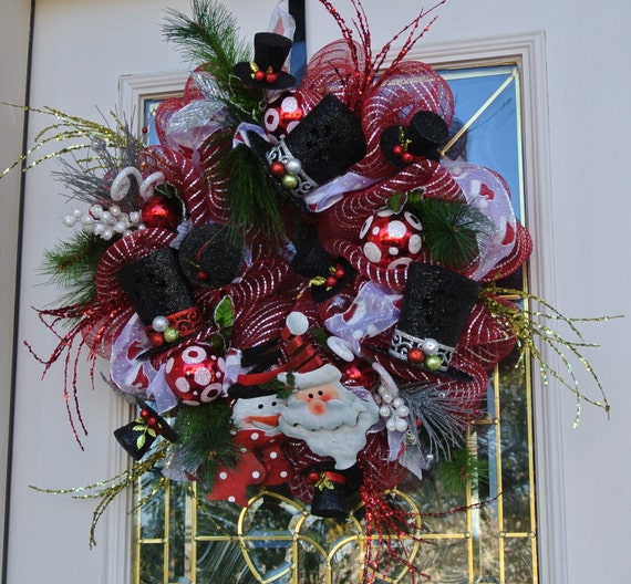 Fun Santa and Snowman Christmas Wreath Top Hats and Red and White Ornaments.