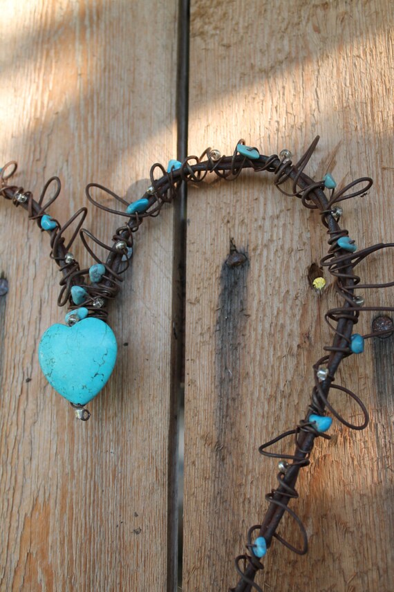 handmade rusted wire heart wall decor with turquoise heart and