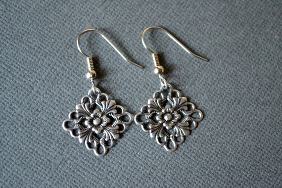 Antiqued Silver Flowers in Diamonds . Earrings