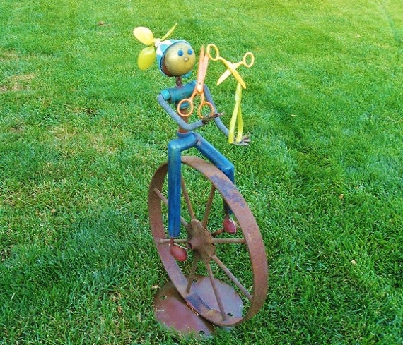 YIKES the uni-cycling juggler steel sculpture by Sistersteel