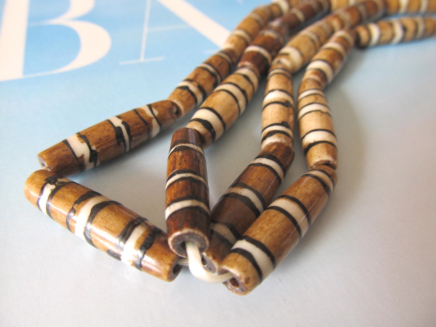 Brown Mud Bone Hairpipe beads. Carved Buffalo by LenniesBeadDrawer