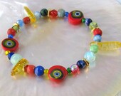 Red Evil Eye Bead Stretch Bracelet / Venetian Murano Glass / Yellow Quartz Daggers / Green and Blue Trade Beads / Heishi Beads / 7 inch
