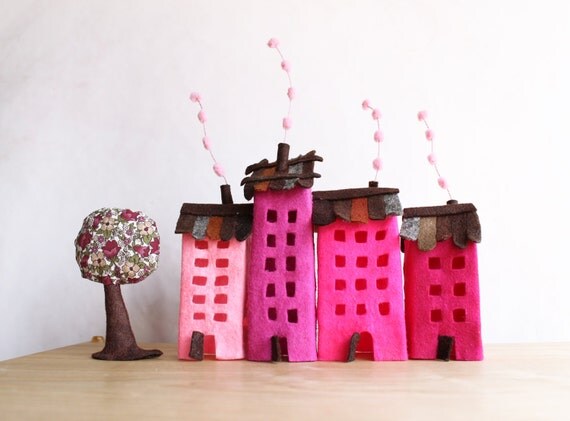 Four buildings of felt, with a tree. Miniature. Decoration.