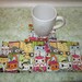 cats eyes with yellow backing set of mug rugs
