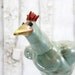 Ceramic garden bird plant stake: Wild Hair Bird, for mounting in the yard or garden in mint green, red, and yellow