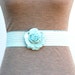 Ladies stretch belt with rose clasp in mint by Charmant Belts, 1980's.