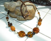 Necklace/ Brown Lampwork beads/ Other beads brown, cream, black/ Toggle claps.