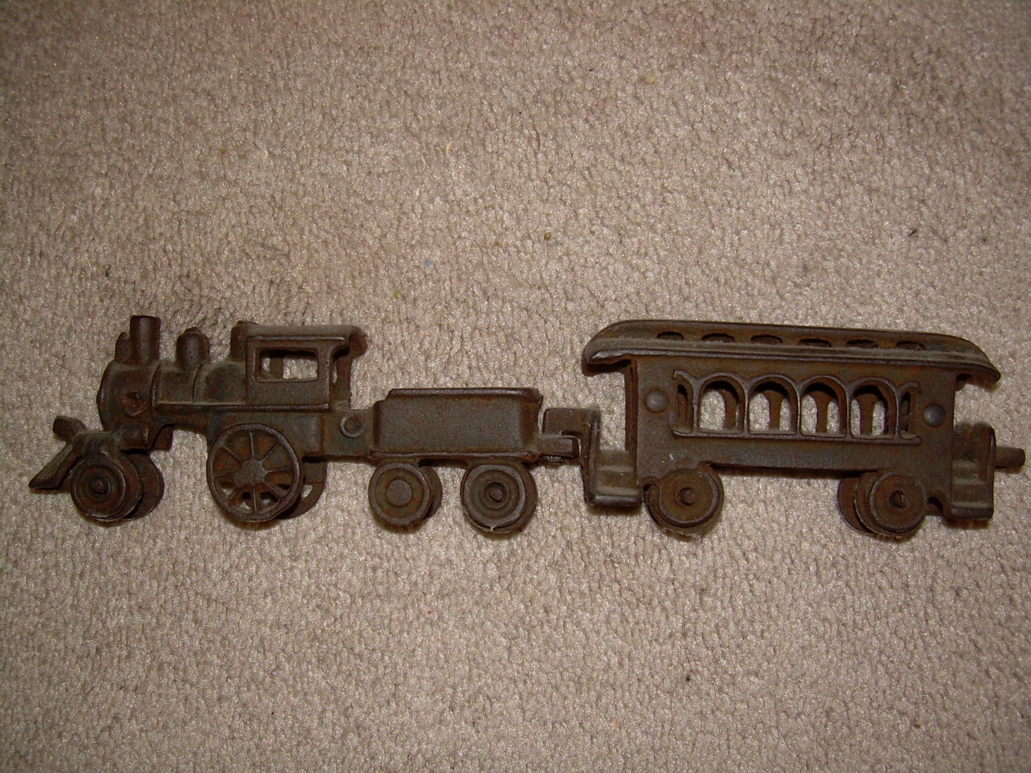 Vintage Cast Iron toy locomotive with car floor train number