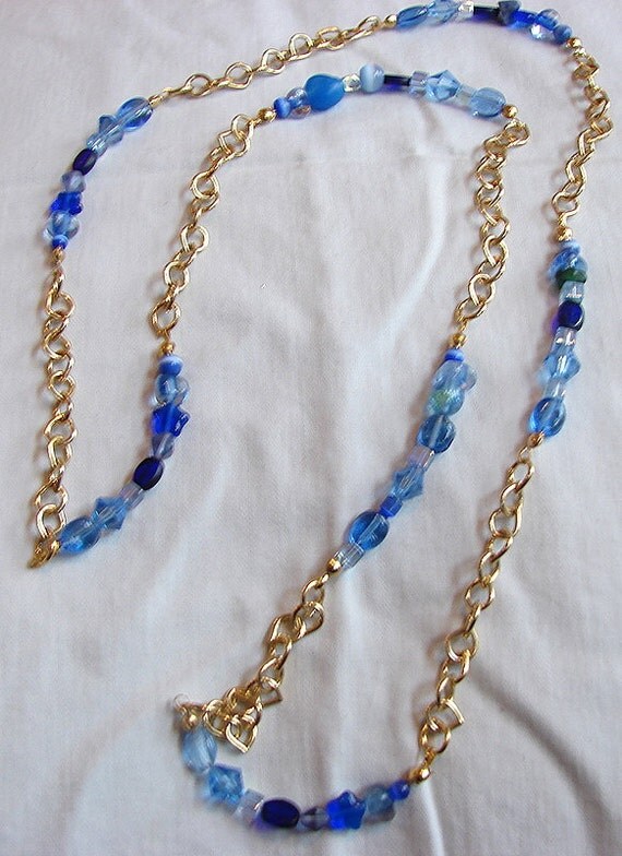 Items similar to Blue and Gold Long Necklace on Etsy