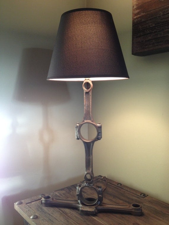 Hand crafted table lamp using repurposed engine/car parts.