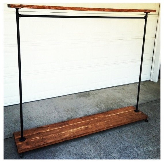 Items similar to reclaimed wood and pipe rolling rack on Etsy