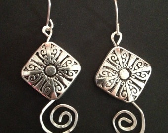 Silver earrings with hammered swirls