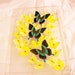 Real Swarm of Beautiful Emerald Green Butterflies Among An Array of Pastel Yellow Butterflies