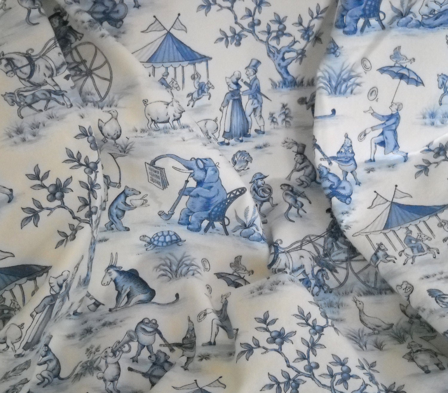 blue and white toile circus print decorator fabric. by