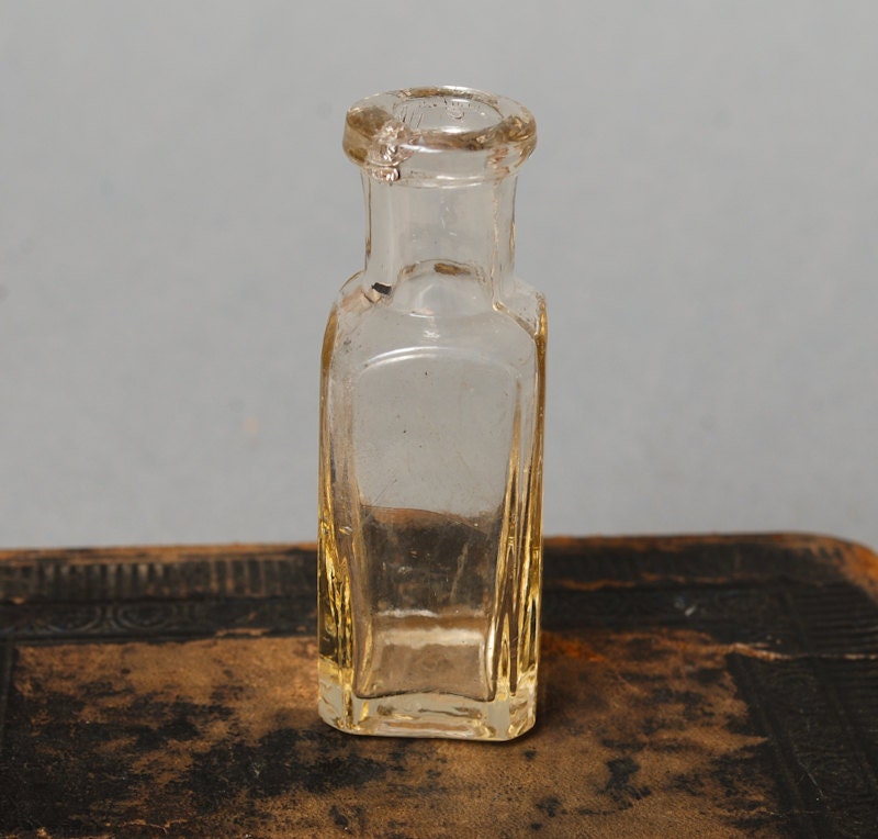 Download Antique small clear glass bottle medical or laboratory