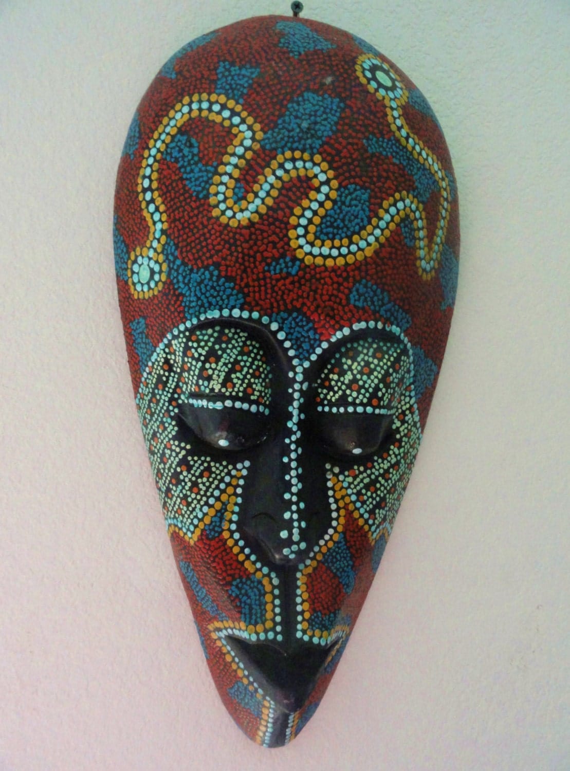 African tribal mask with lovely pindot paint technique in reds