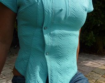 Baby blue blouse with closure at the side.