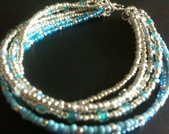 silver and blue bracelet