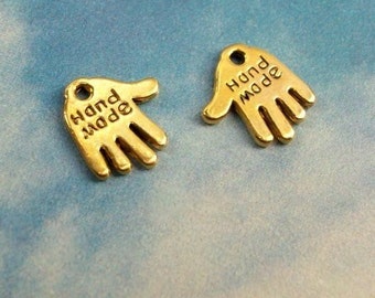 240 tiny hand shaped charms say HAND MADE small metal hang