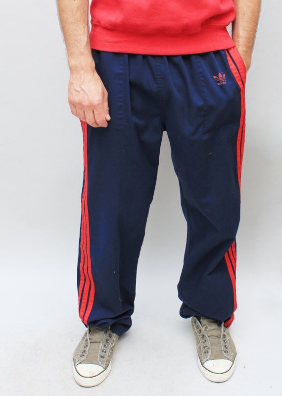 blue sweatpants with red stripe