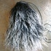 Mongolian sheep skin bag to keep change or crystals in. Or as a wall hanging or glasses case.