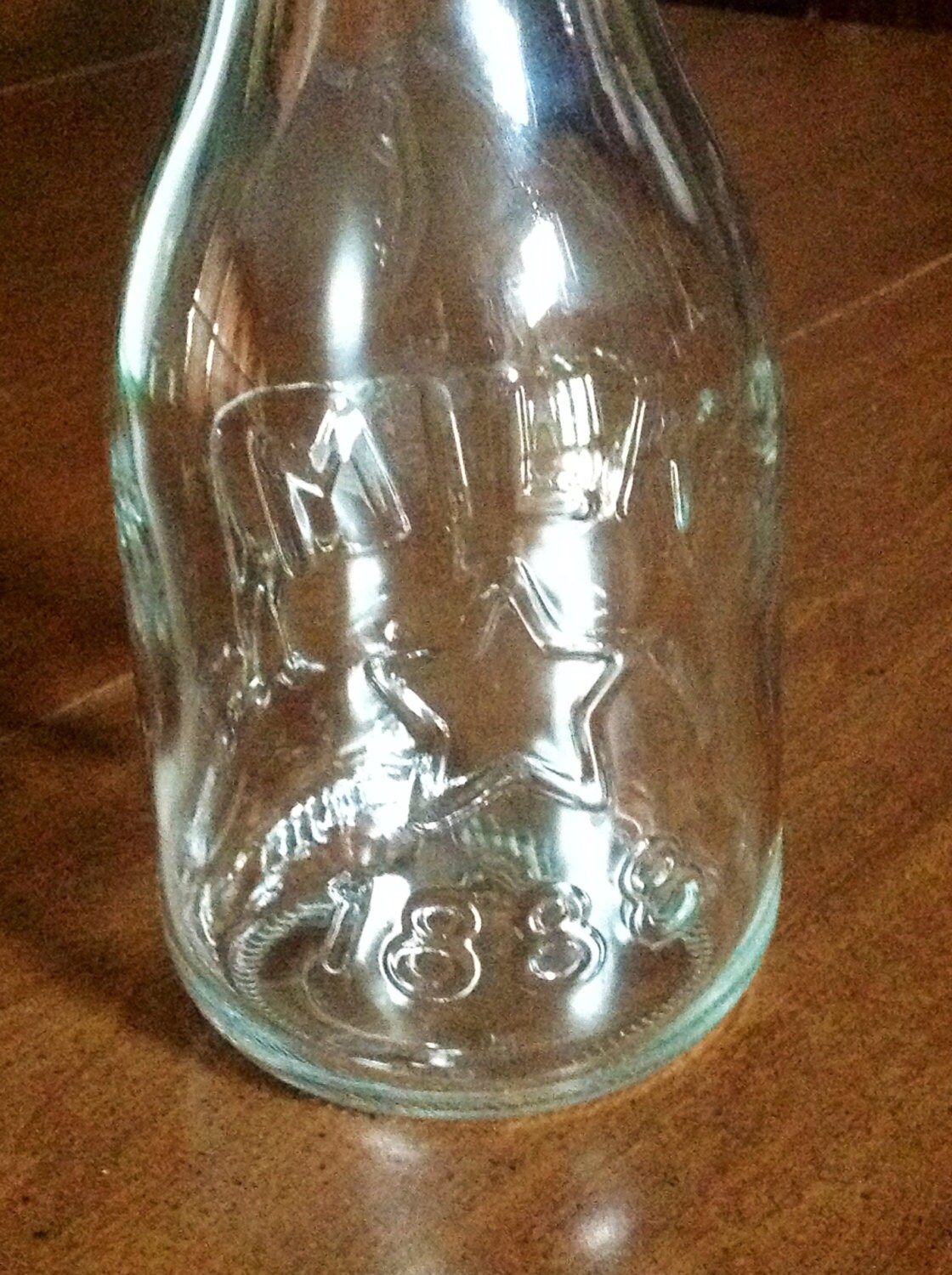 Glass milk decanter raised cow star 1888