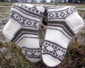 White, gray hand knitted socks with ornaments