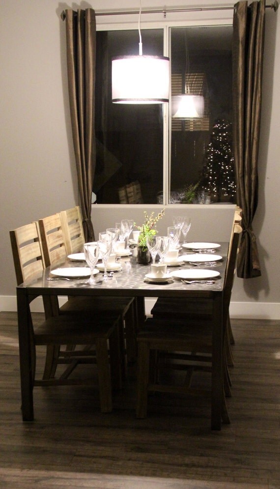 Beautiful steel dining table with clear coat by CraftMetalWorks