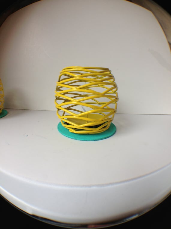 Yellow laquered votive candle holder