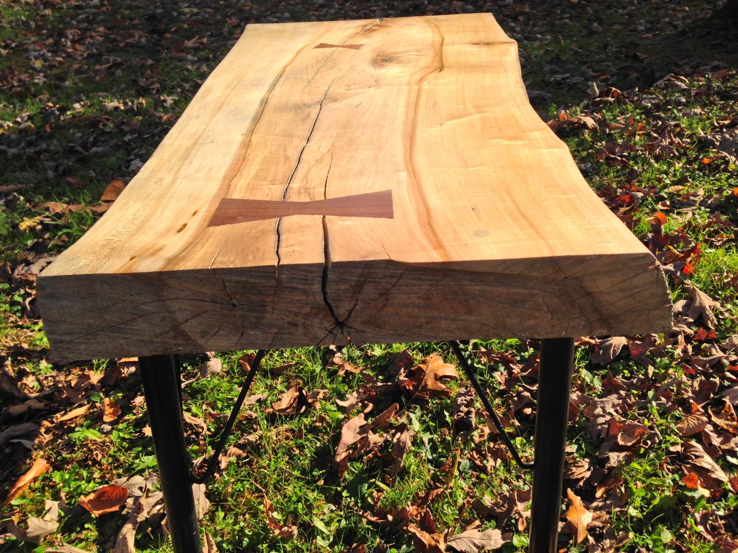 Live edge maple slab coffee table with hand cut walnut bow tie