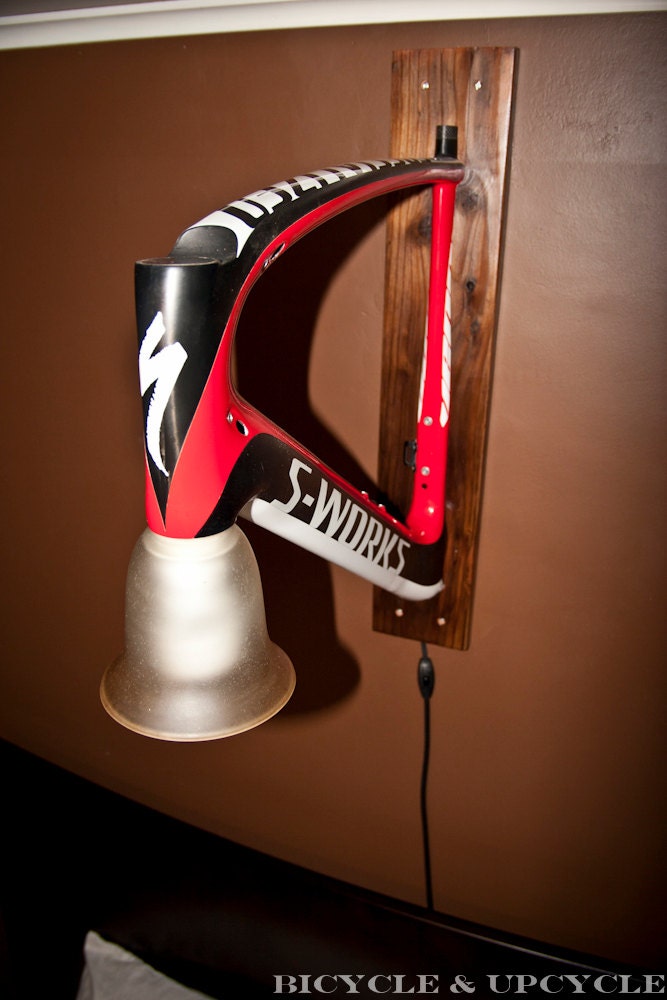 Unique handmade upcycled bike frame wall lamp. Recycled bike