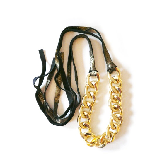 black bag with chunky gold chain