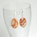 Sterling silver earrings with rare opal gemstones, orange, white, brown, mexican fire opal oval shaped stones, sterling silver swirls