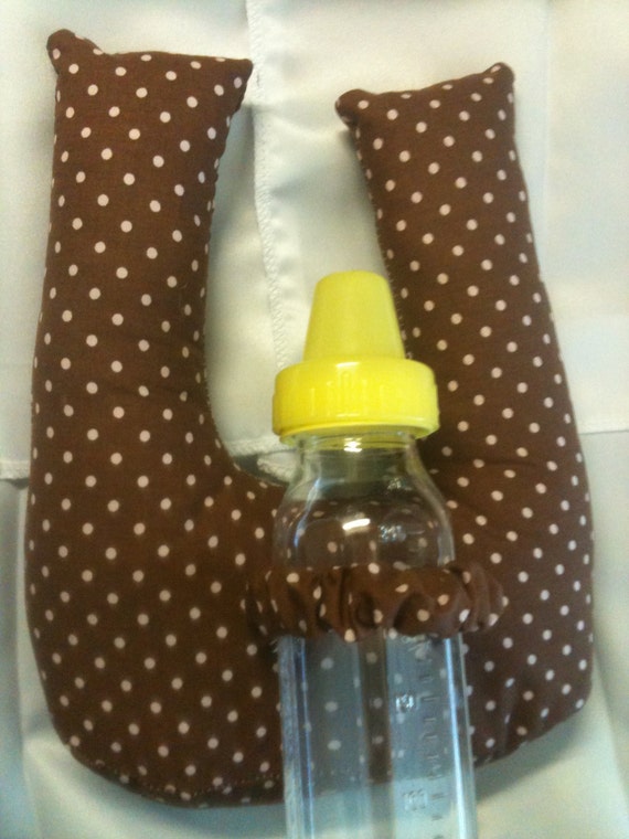 Baby bottle holder/prop lays of the chest of the by sidneyray0