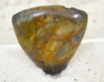 morrisonite jasper trillion cabochon. 21.5 x 21.5 dark greens and orange