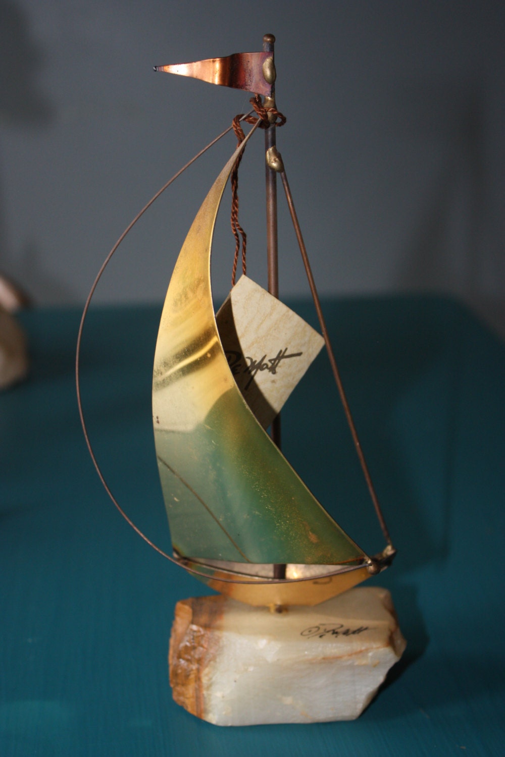 signed brass sailboat sculpture