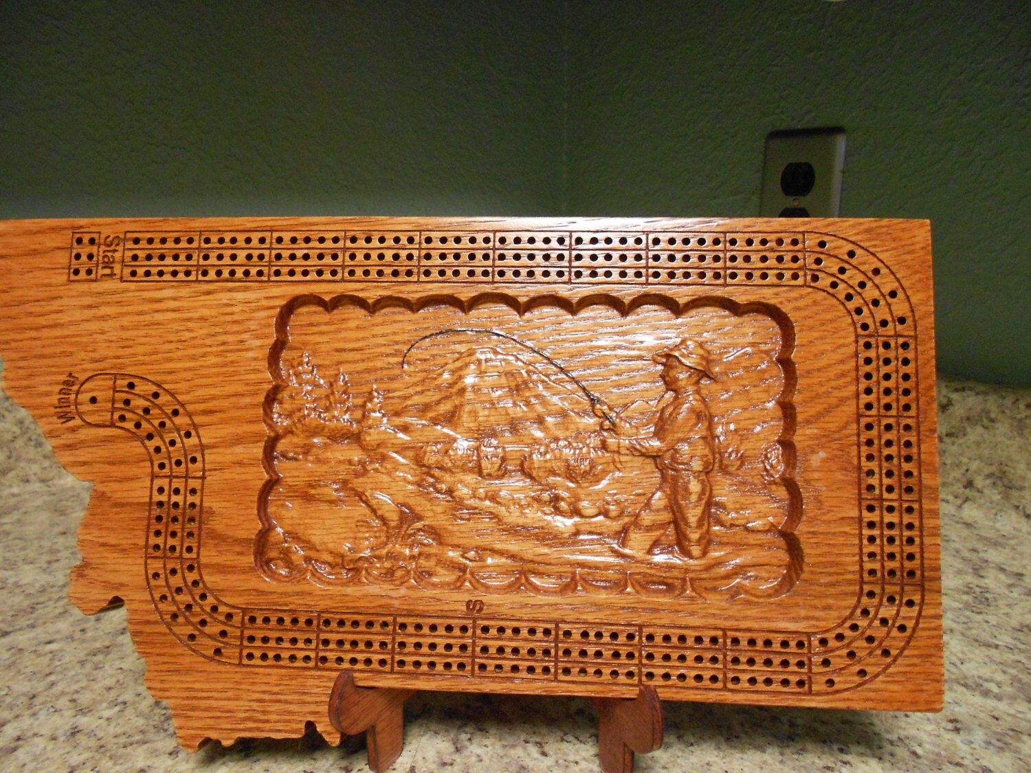 Montana shaped handmade three track cribbage board with a