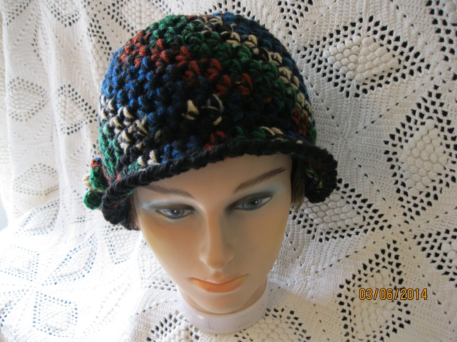 A one of a kind ladies crochet bill hat made of back and